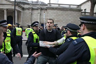 Confrontation: Charlie Veitch at the anti-cuts demonstration in London on Saturday. On his website he says: 'The main aim is for police to lose control'