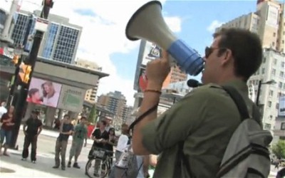 Charlie Veitch, before his change of heart, protesting in New York's Times Square