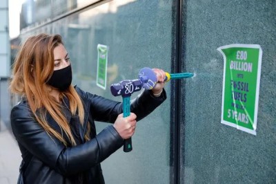 2021: An activist from the Extinction Rebellion shatters a window at HSBC headquarters in Canary Wharf