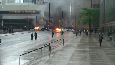 Police leave police cars to burn until people with cameras leave