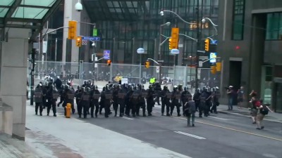 Police outside the ring of steal on Wellington Street West.