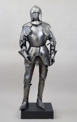 Circa 1450. This style of sallet, fitted closer to the head than the German form seen nearby, was developed in Venice, but this example was produced in Milan, a center for the highest quality armor.