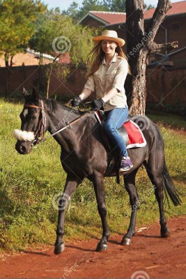young-woman-riding-black-horse.jpg
