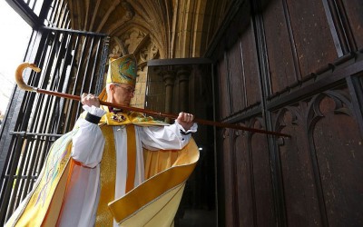 The Archbishop of Canterbury, The Most Reverend Justin Welby, strikes three times on the West Door of Canterbury Cathedral with his pastoral staff prior to his Enthronement in Canterbury, March 21, 2013.